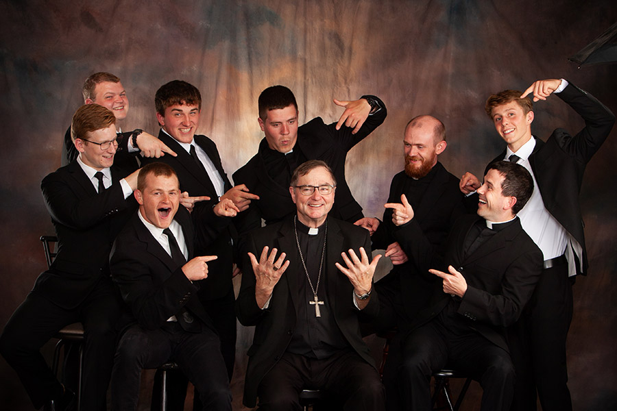 Bishop, Fr David, and seminarians.102325